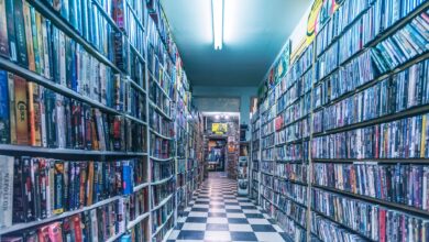 Explore a nostalgic video store aisle filled with classic VHS tapes, capturing retro vibes.