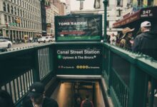 Canal Street Station entrance with urban street scene in New York City.