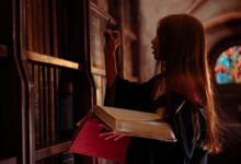 Young woman in wizard costume explores a mystical library with spellbooks.