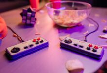 Retro gaming scene featuring classic 8-bit controllers and a relaxed setting with snacks.