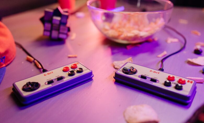 Retro gaming scene featuring classic 8-bit controllers and a relaxed setting with snacks.