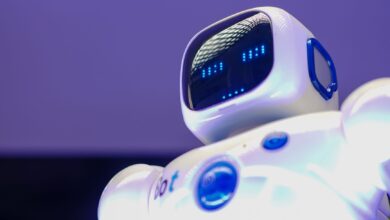 A modern humanoid robot with digital face and luminescent screen, symbolizing innovation in technology.