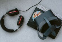 A flat lay of a VR headset and gaming accessories on a table.