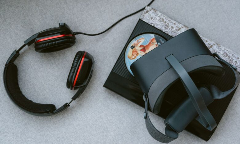 A flat lay of a VR headset and gaming accessories on a table.