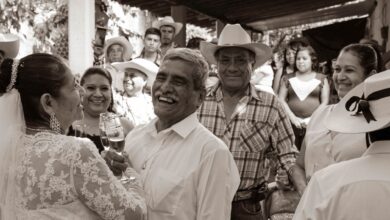 Lively wedding celebration with happy guests in traditional attire in Mexico.