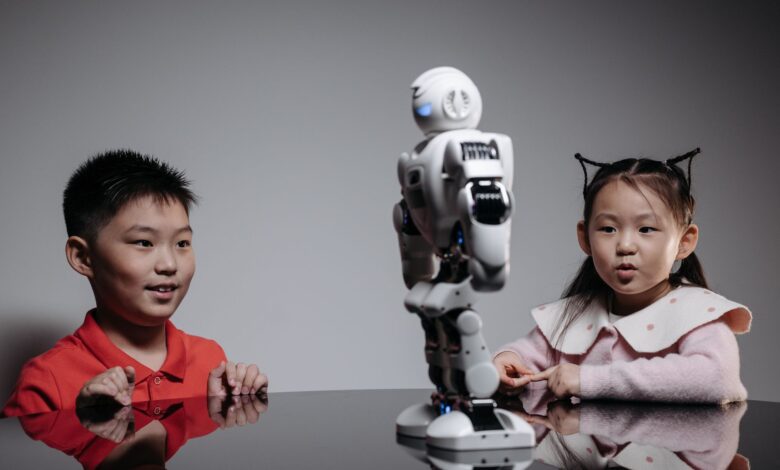 Kids amazed by a humanoid robot during an indoor play session, showcasing technology and learning.