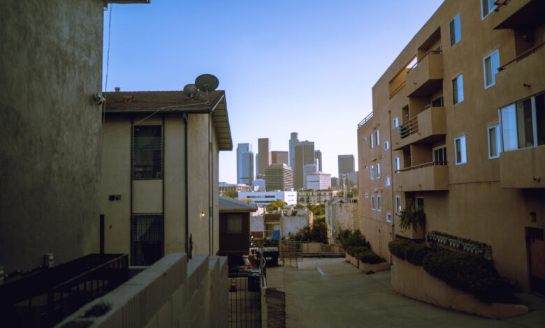 View of downtown skyscrapers from residential area, perfect for urban lifestyle themes.