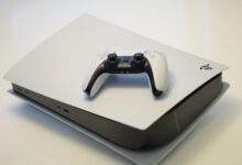A sleek gaming console with a compatible controller, ideal for tech enthusiasts.