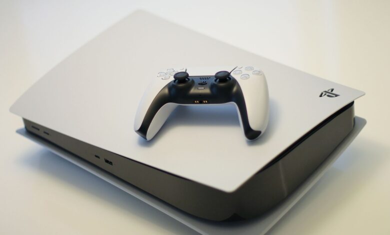 A sleek gaming console with a compatible controller, ideal for tech enthusiasts.