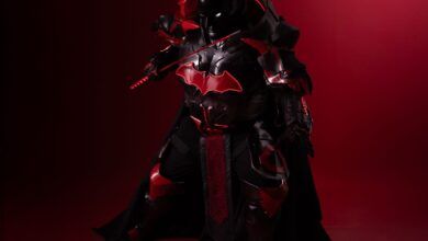 Striking black and red cosplay costume inspired by legendary hero, captured on a dramatic backdrop.