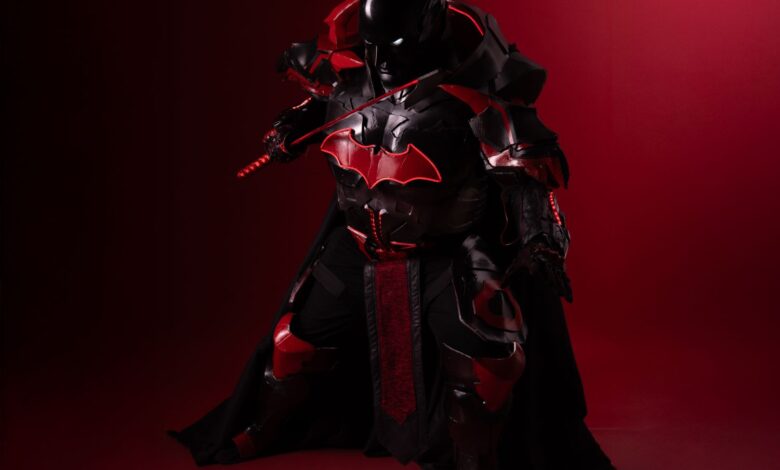 Striking black and red cosplay costume inspired by legendary hero, captured on a dramatic backdrop.