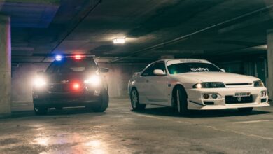 Police and sports cars in a dimly lit underground garage create a tense atmosphere.