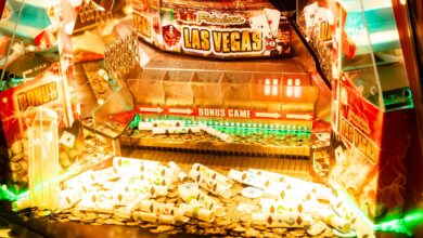 Colorful casino game machine featuring Las Vegas theme with coins and poker cards.