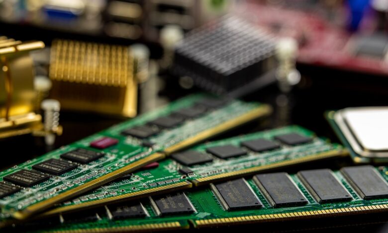 Detailed view of RAM sticks and microprocessors on a motherboard.