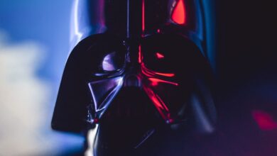Close-up of a Darth Vader mask with striking lighting effects, showcasing cinematic appeal.