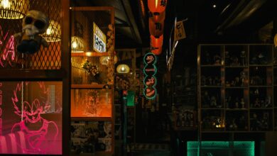 Dark, moody Tokyo diner with neon signs and anime decor, capturing cyberpunk culture.