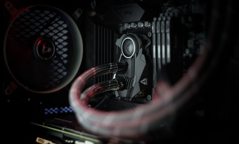 Detailed view of a computer's cooling system showcasing advanced technology with illuminated components.