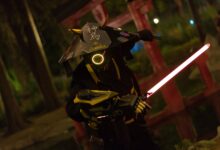 A captivating image of a futuristic samurai warrior cosplay illuminated by neon lights in a night environment.