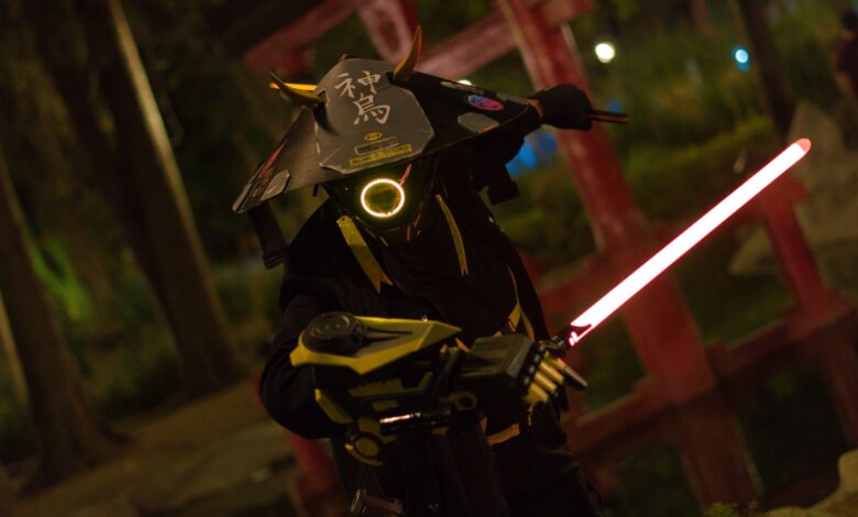 A captivating image of a futuristic samurai warrior cosplay illuminated by neon lights in a night environment.