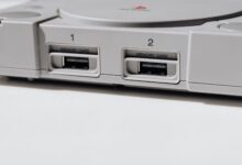 Detailed view of vintage PlayStation console featuring memory slots, capturing nostalgia.
