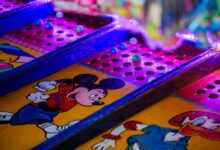 Vibrant arcade game featuring iconic cartoon characters under colorful lighting.