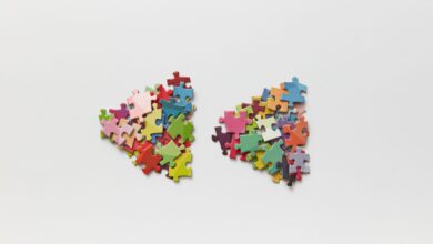 Brightly colored puzzle pieces arranged on a white surface, ideal for creative projects.