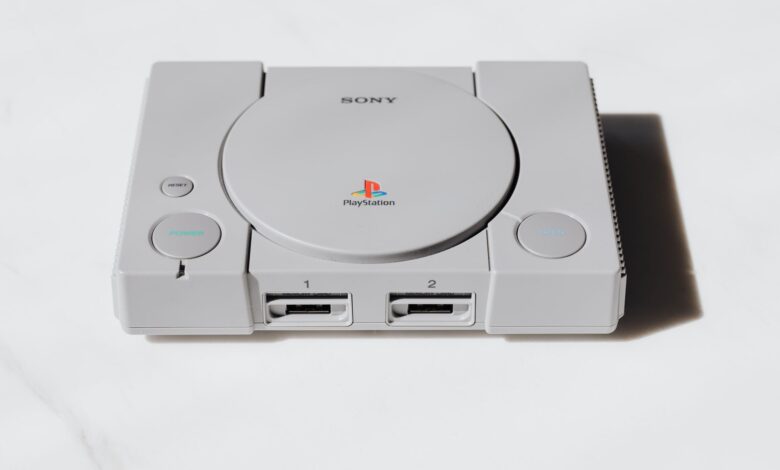 A classic Sony PlayStation console captured on a white background exuding retro gaming nostalgia.