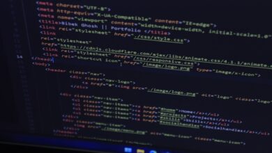 High-resolution close-up of HTML code displayed on a computer screen, perfect for technology themes.