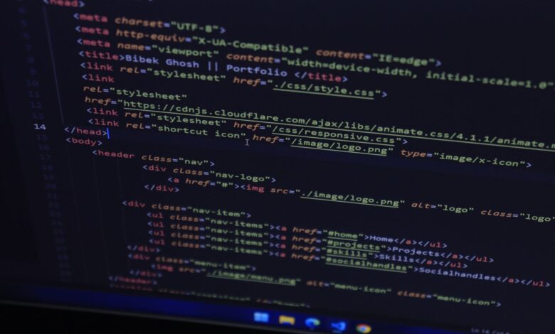 High-resolution close-up of HTML code displayed on a computer screen, perfect for technology themes.