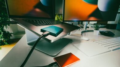 Stylish home office setup featuring laptop and external drives for data storage and backup.