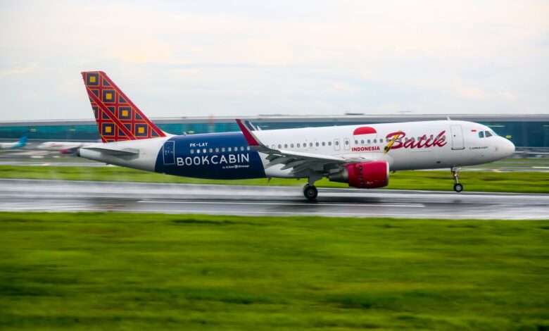 Batik Air Airbus A320 landing on a runway in Banten, Indonesia, showcasing aviation and travel.