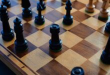 Chessboard with black and white pieces showcasing strategic positioning.
