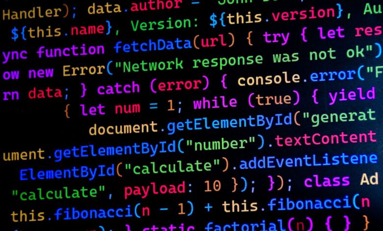 Close-up of colorful JavaScript code displayed on a computer monitor, ideal for tech-themed projects.