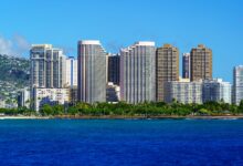 Stunning view of Honolulu's skyline with modern skyscrapers and blue ocean backdrop.
