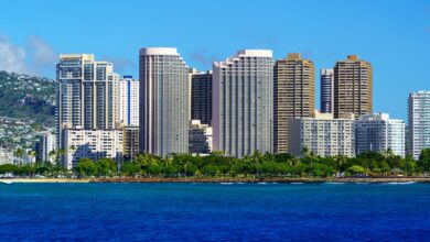 Stunning view of Honolulu's skyline with modern skyscrapers and blue ocean backdrop.