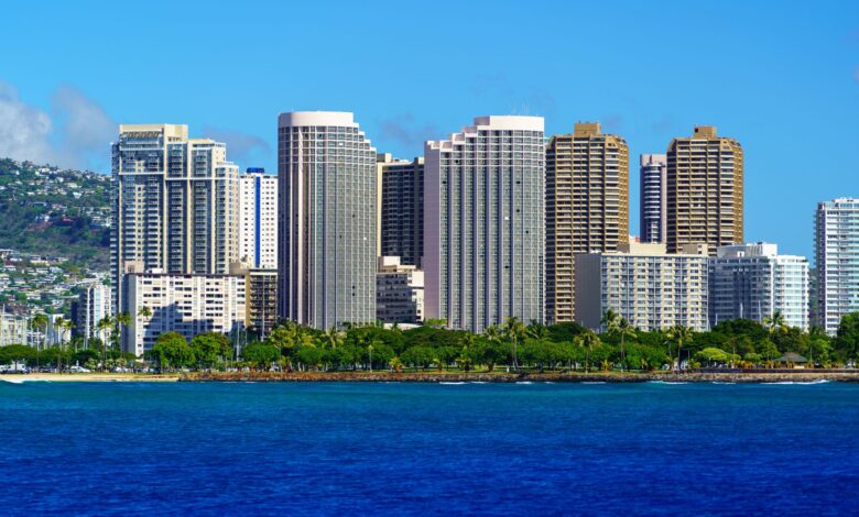 Stunning view of Honolulu's skyline with modern skyscrapers and blue ocean backdrop.