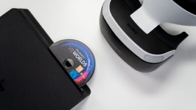 Overhead view of PlayStation console, VR headset, and game disc on a white background.