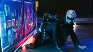A stylish cyberpunk woman crouching in futuristic neon-lit setting with a gun.