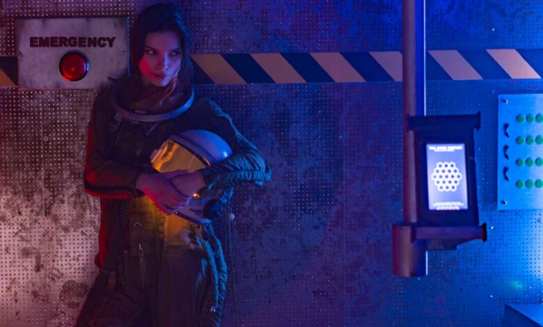 Astronaut in a futuristic setting with emergency alert. Ideal for sci-fi themes.