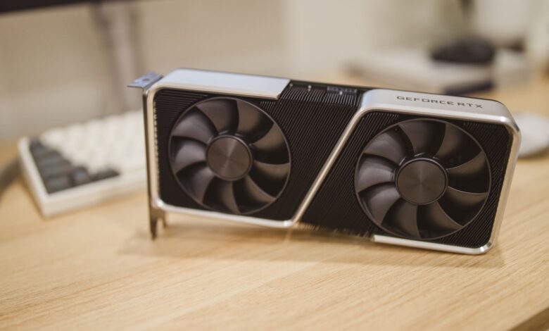 Close-up of a GeForce RTX graphics card on a desk, showcasing its design and technology.