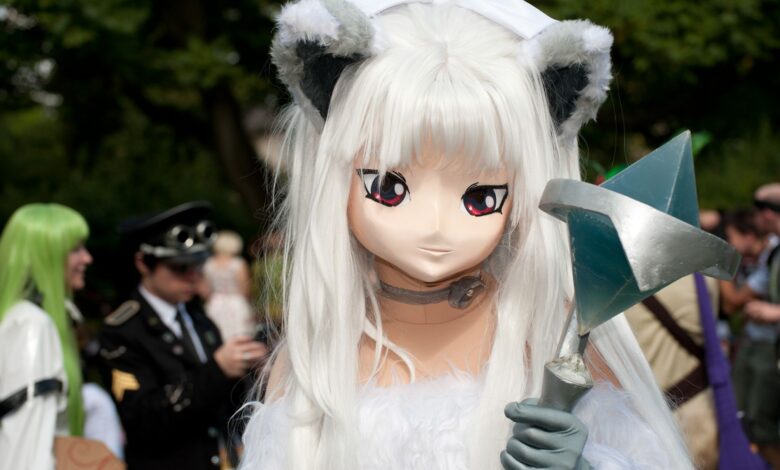 A striking cosplay character with unique costume at an outdoor convention setting.