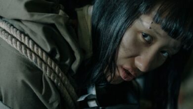 A woman with eyebrow piercing in urban survival gear, conveying a dystopian feel.