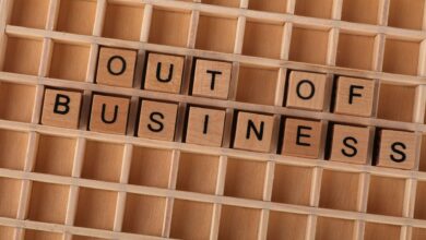 Wooden blocks spelling out 'Out Of Business' symbolize closure or economic downturn.