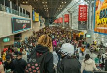Lively crowd at New York Comic Con in Javits Center, showcasing cosplay and fan culture.