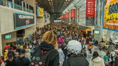 Lively crowd at New York Comic Con in Javits Center, showcasing cosplay and fan culture.
