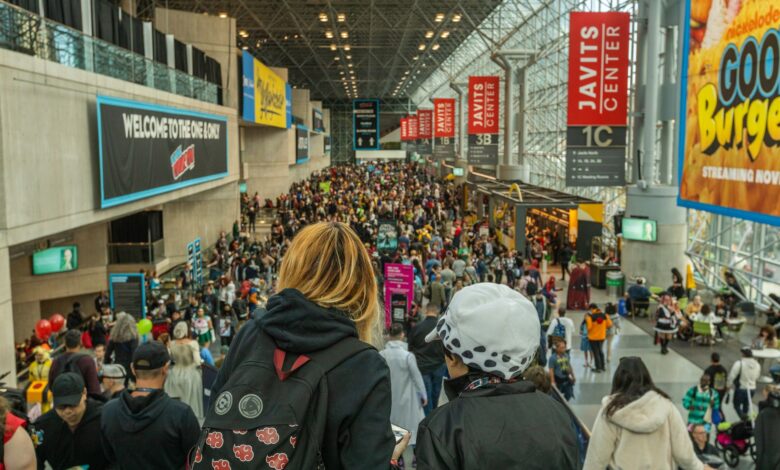Lively crowd at New York Comic Con in Javits Center, showcasing cosplay and fan culture.