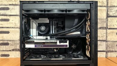 Detailed view of a custom-built gaming PC with visible components like graphics card and cooling system.