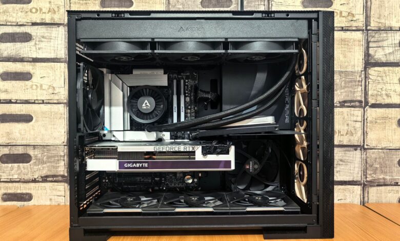 Detailed view of a custom-built gaming PC with visible components like graphics card and cooling system.
