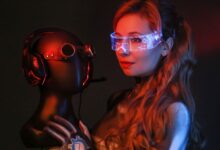 A woman in a sci-fi costume with goggles and gloves poses in a studio holding a mannequin head.