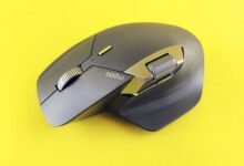 Close-up of a high-tech wireless mouse on a vibrant yellow backdrop, ideal for tech and lifestyle themes.